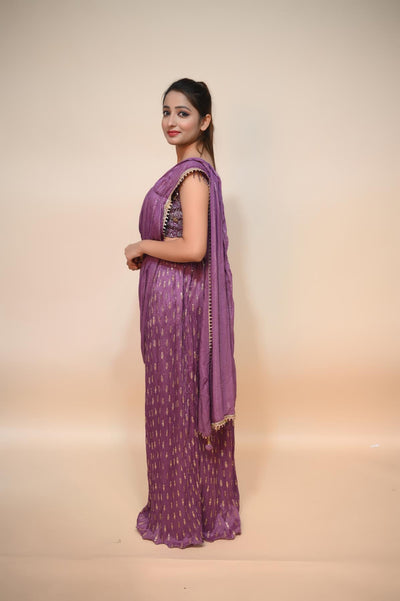 model posing wearing purple net saree