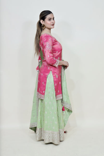 Girl Wearing a Majenta & Green Color Floral Motif Sharara Set