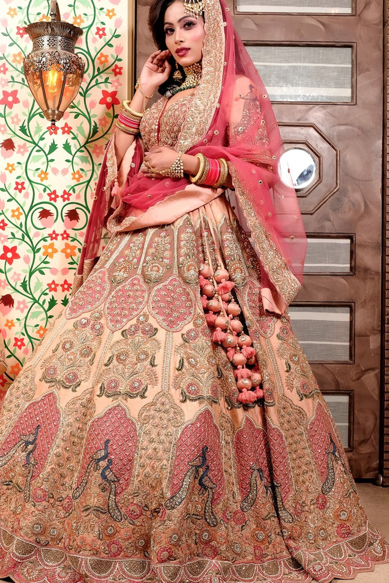 Bridal lehenga paired with peach color heavily embellished choli
