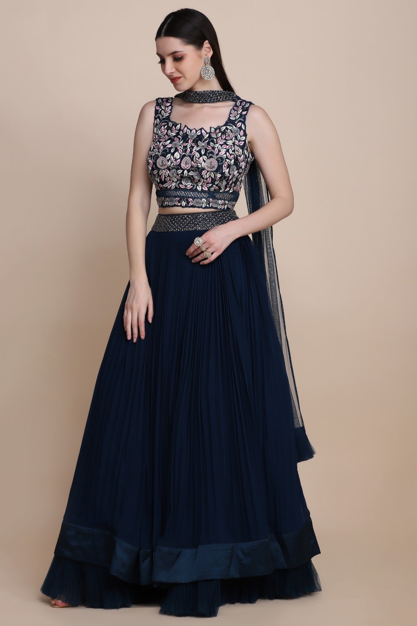 Beautiful blue color floral motif embroidered pleated effect flared lehanga with sleeveless blouse with deep back and drape dupatta