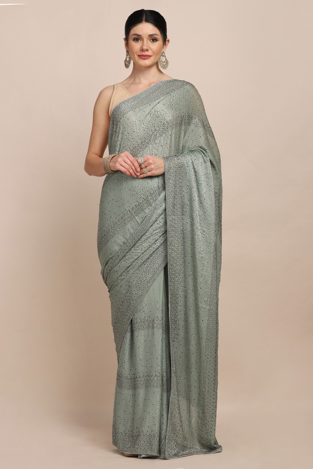 Classy green color embroidered saree