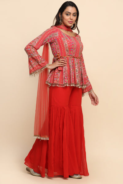 girl wearing a Beautiful Red Color Floral Motif Embroidered Sharara Set