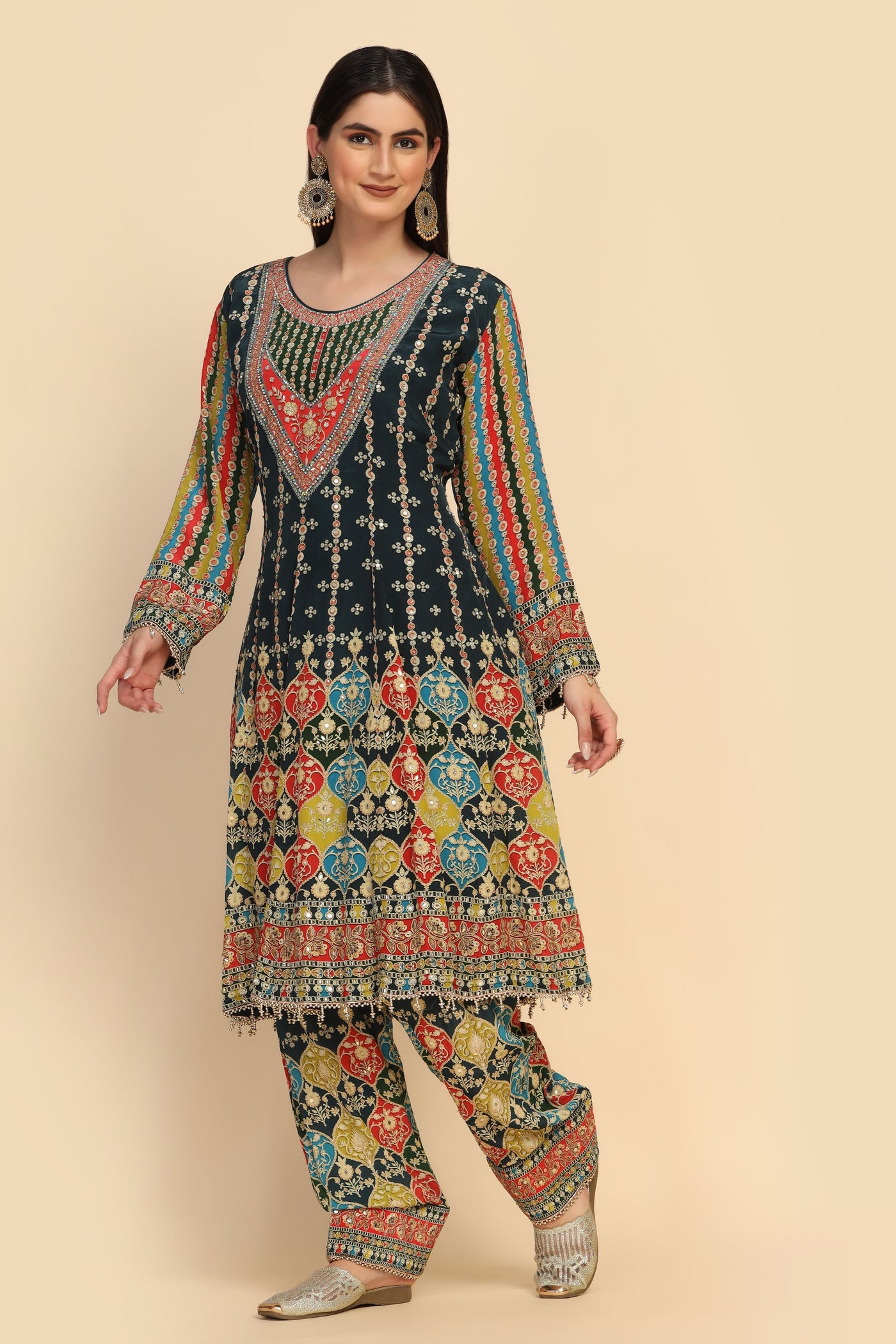 girl wearing a multi color floral motif embroidered suit