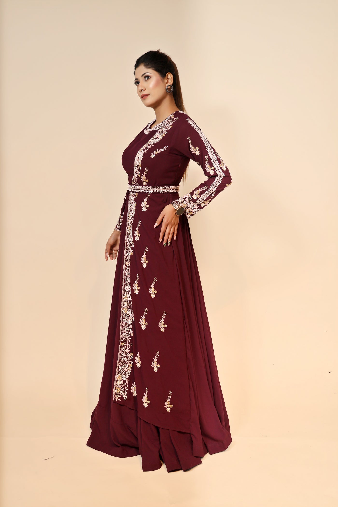 model posing in maroon georgette dress