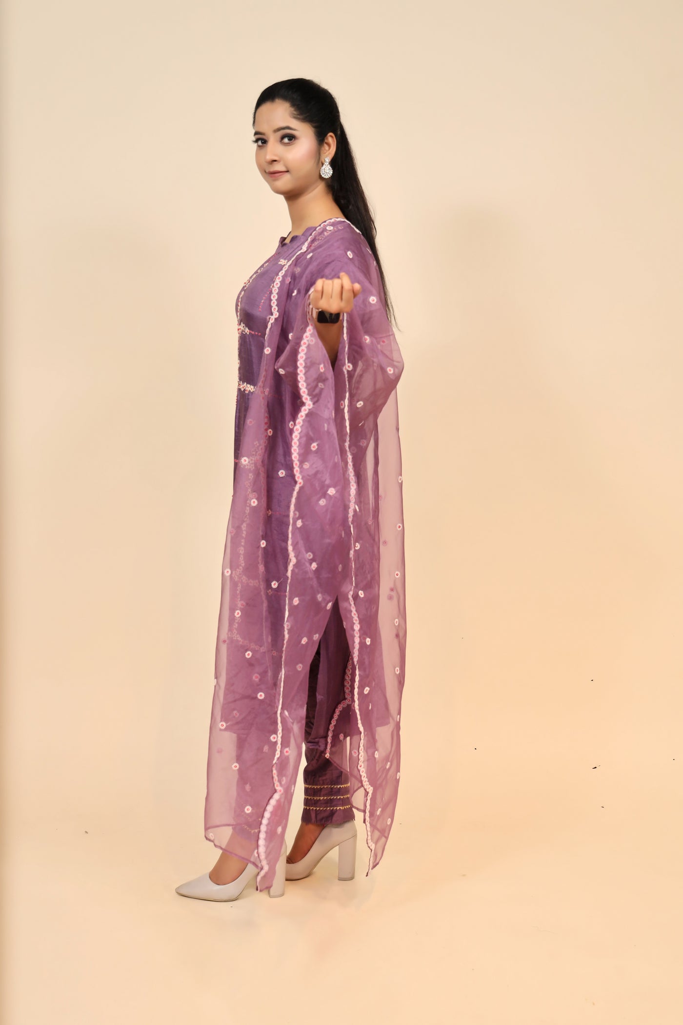model posing wearing purple raw silk suit