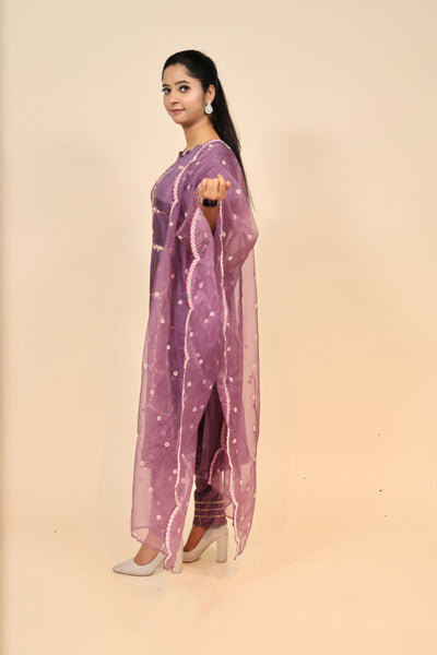 model posing wearing purple raw silk suit