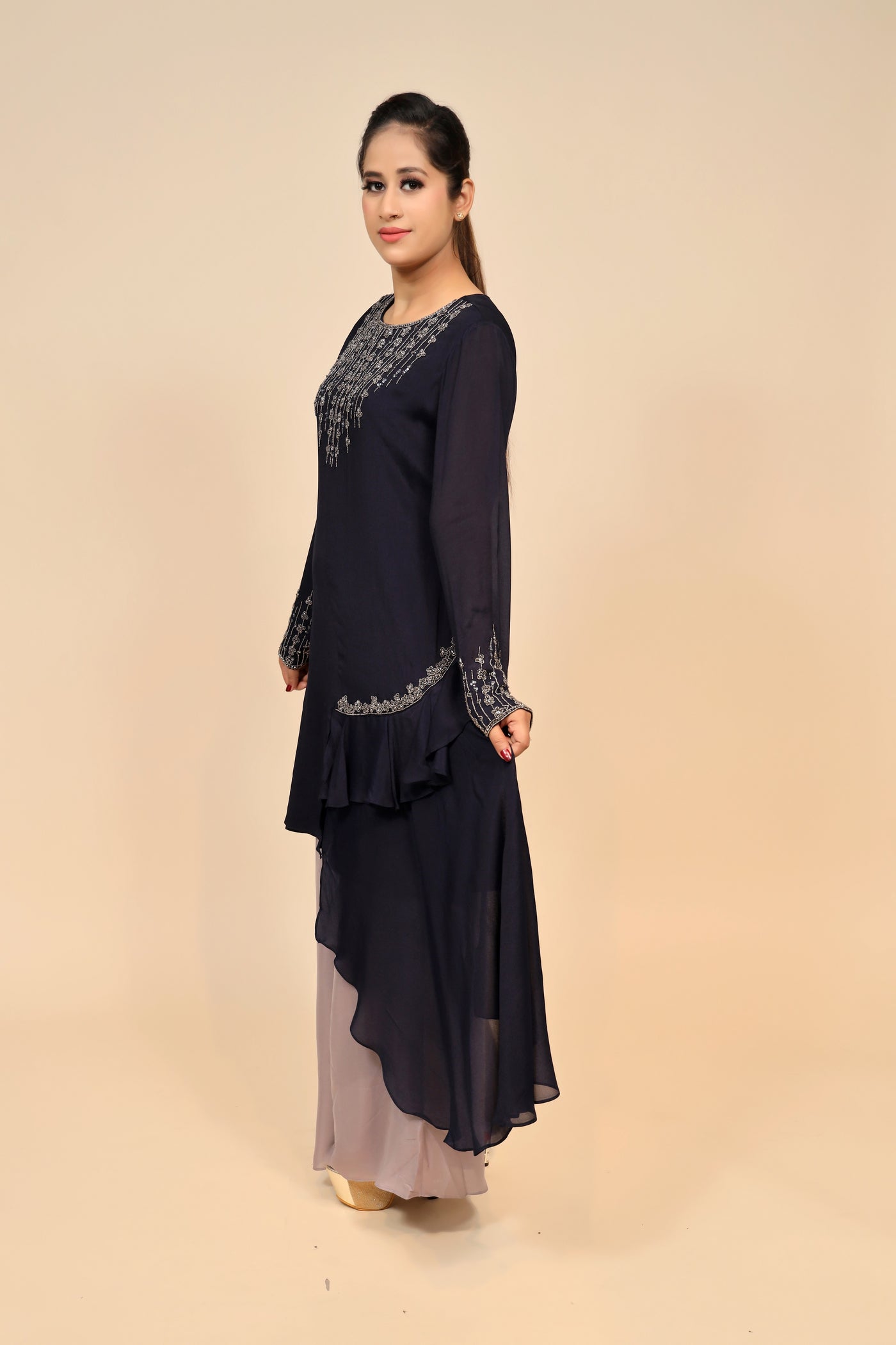 model posing wearing navy blue chinon dress