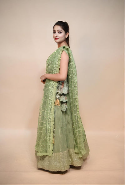 model posing wearing mint green dress