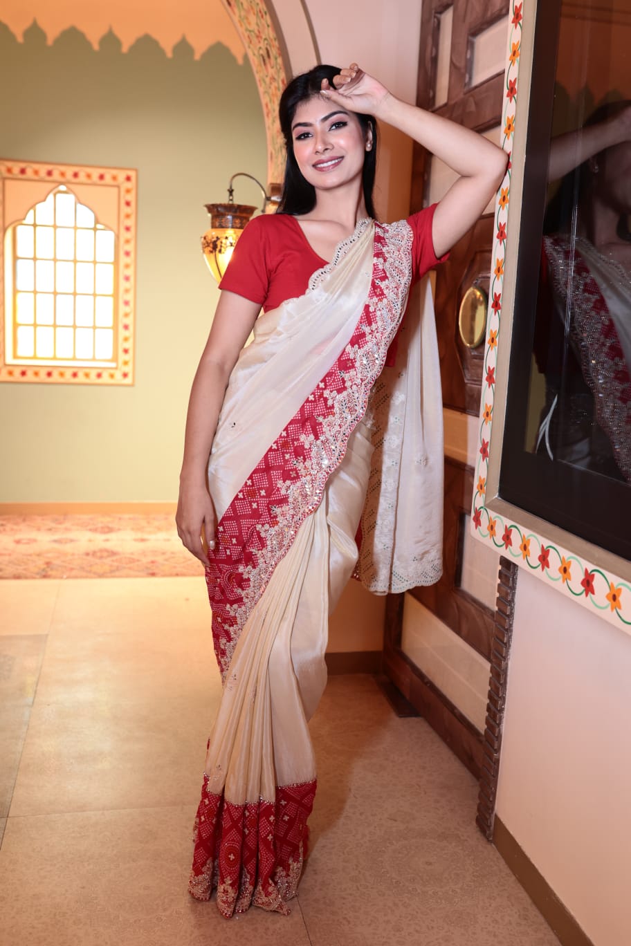 Elegant Cream and Red Tissue Saree with Intricate Border Detailing