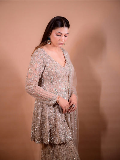 The Luxury Shimmering Peplum Sharara Wore by "Sapna Choudhary"