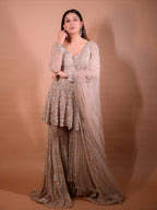 The Luxury Shimmering Peplum Sharara Wore by "Sapna Choudhary"