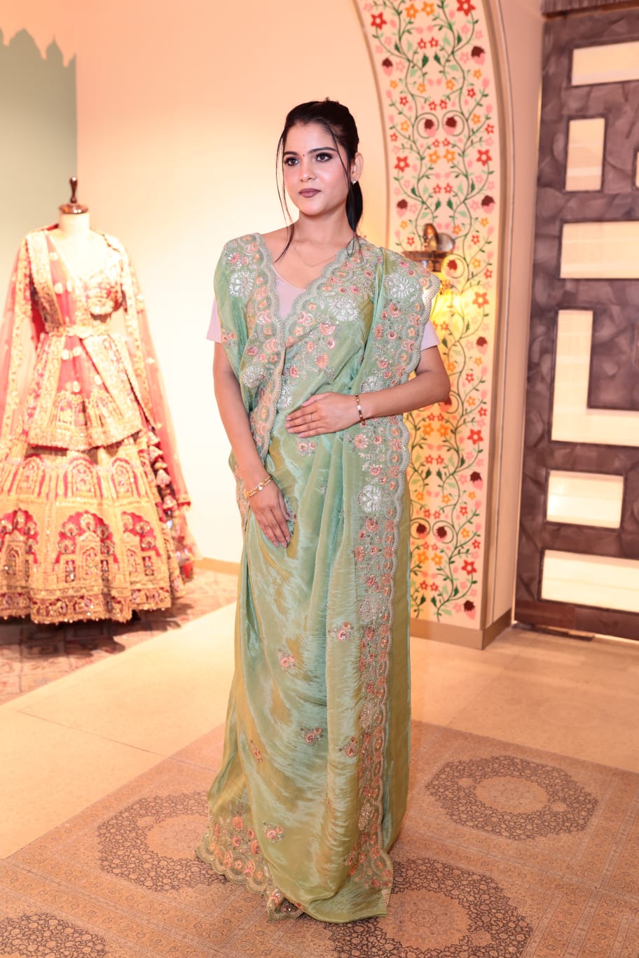 Exquisite Pale Green Lama Georgette Saree with Embroidered Border