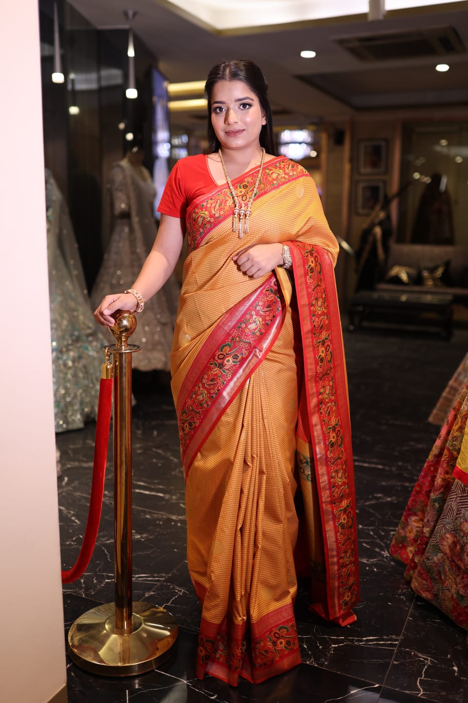 Stunning Orange Banarasi Saree with Elegant Red Border