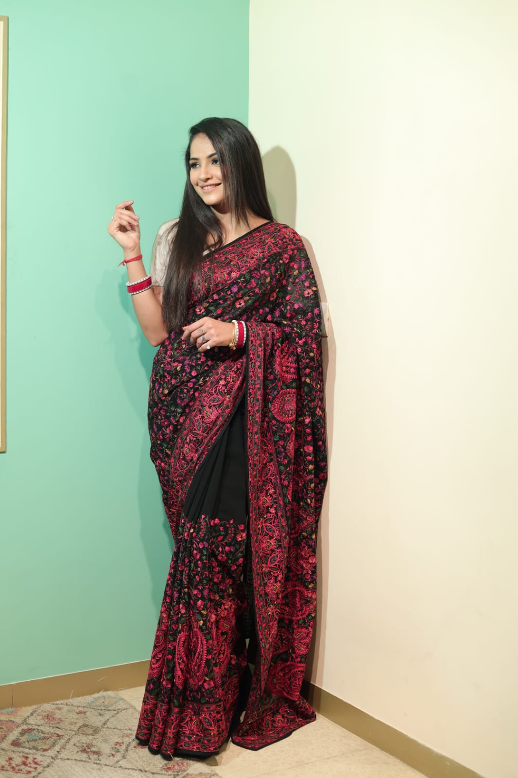 Elegant Black Georgette Saree with Intricate Red Embroidery