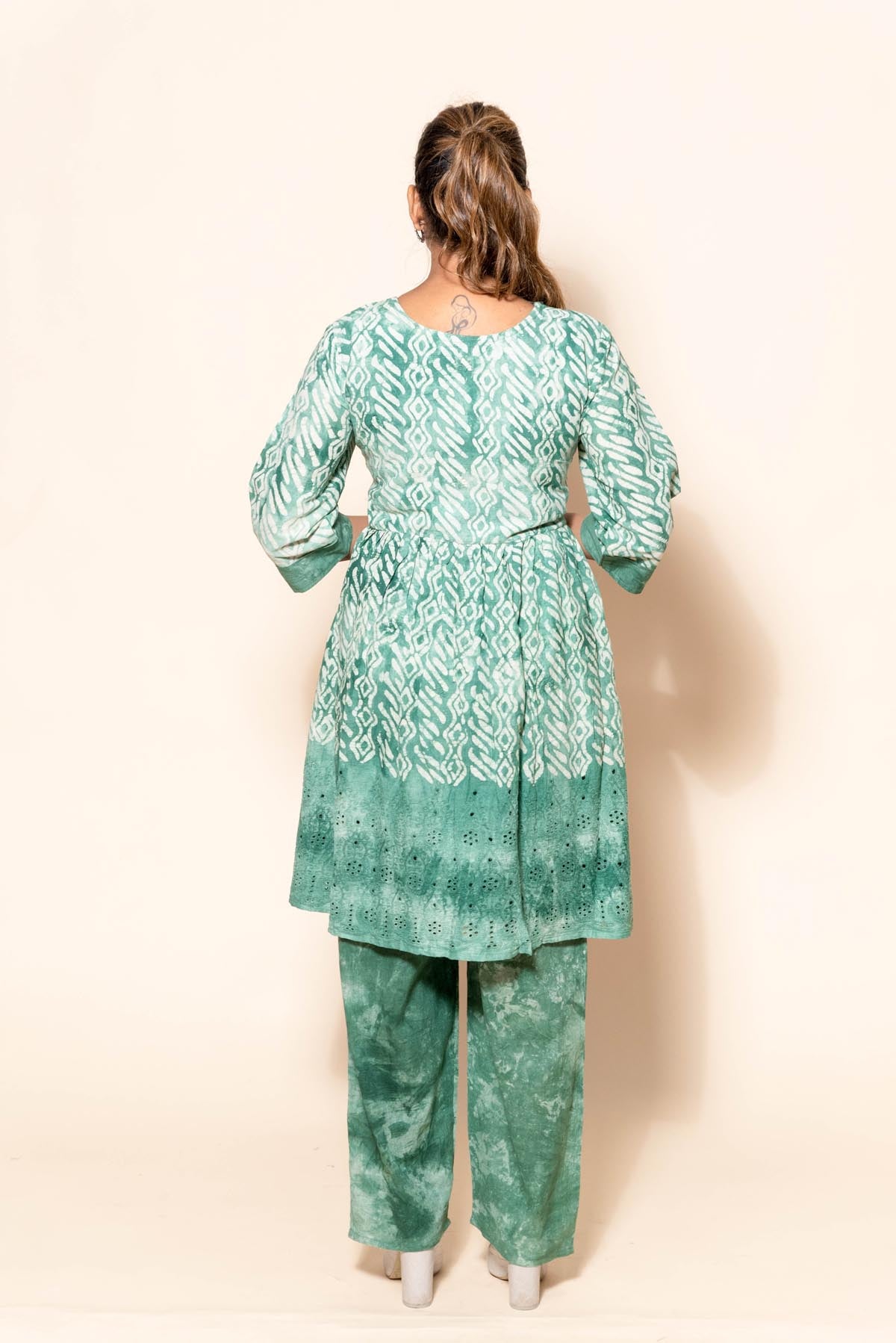 full back look of green cotton embroidery suit