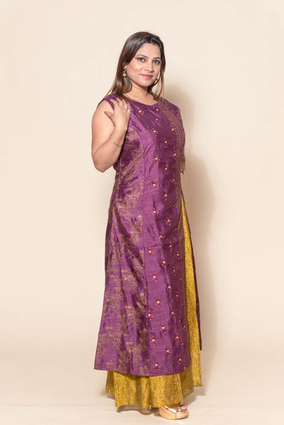 side profile of woman in purple and mustard resham work dress