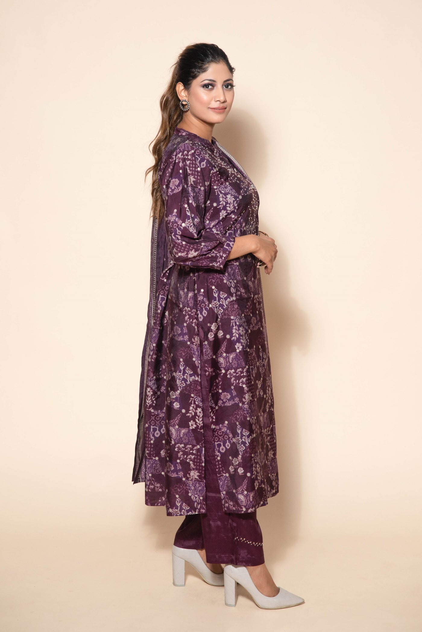 model posing wearing purple silk suit