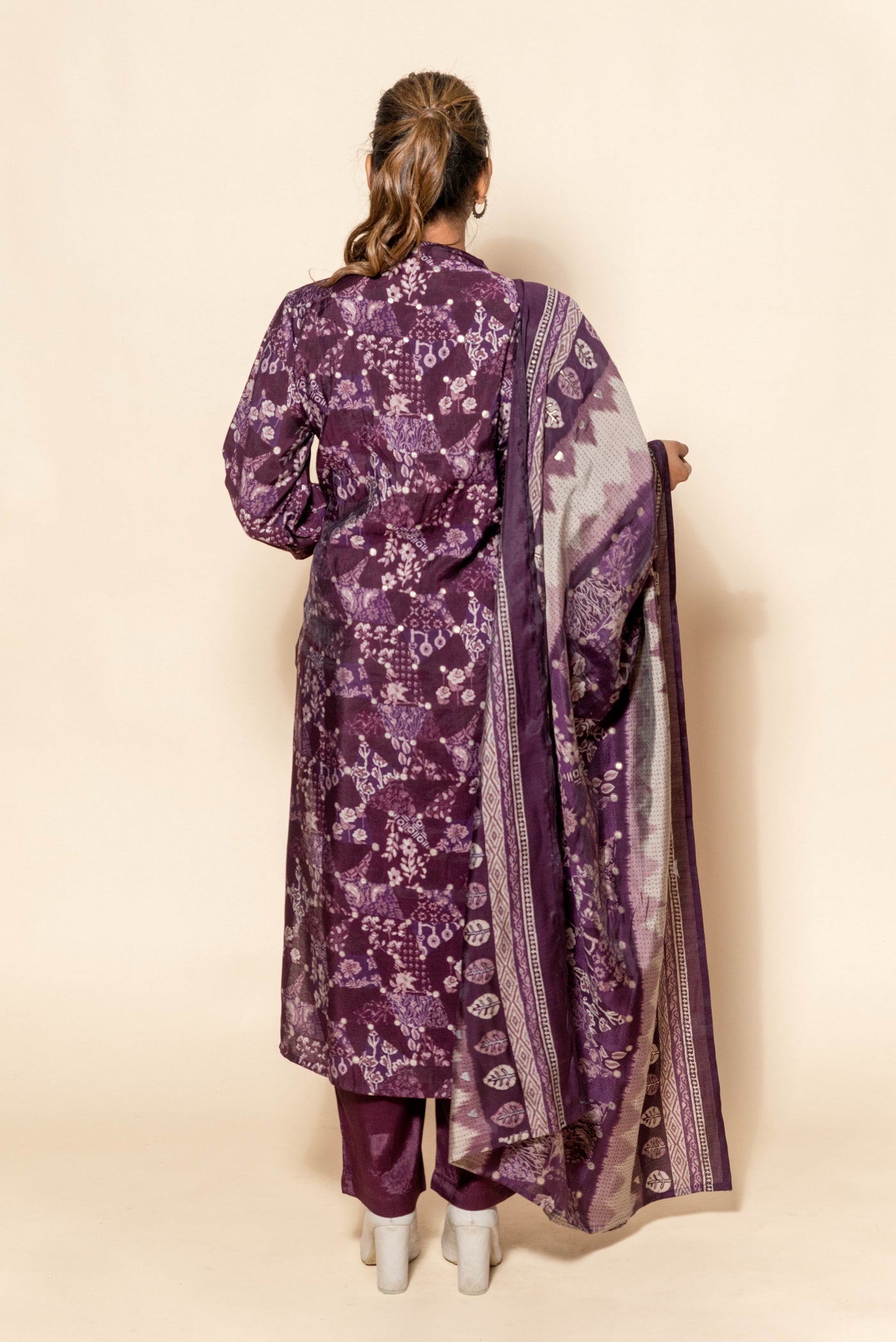 full back look of purple silk suit