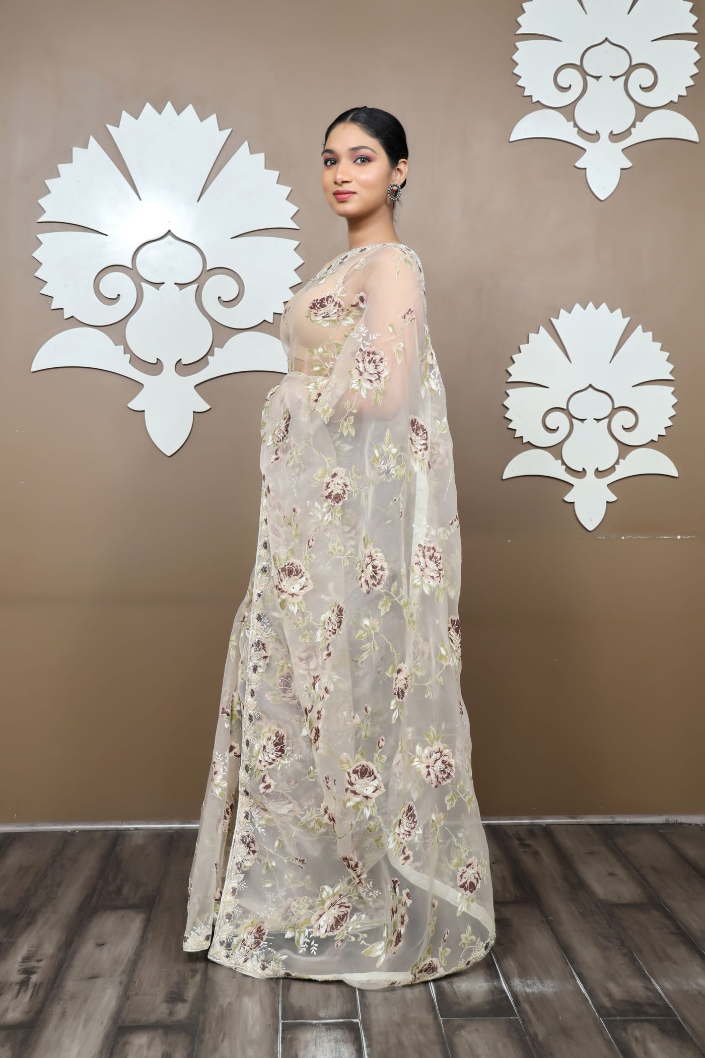 classy cream color floral motif  embroidered saree