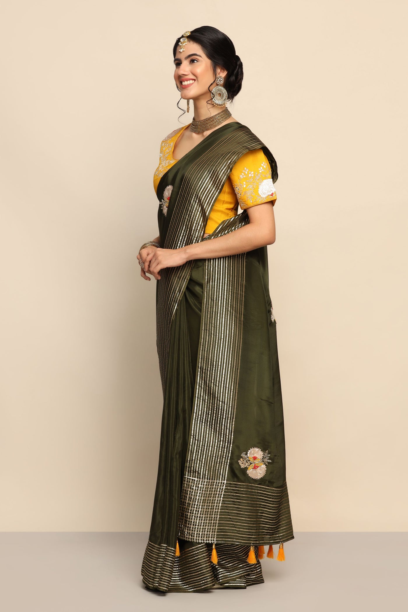Stunning Mehndi Green Saree with Cut Dana and Floral Motif