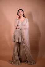 The Luxury Shimmering Peplum Sharara Wore by "Sapna Choudhary"