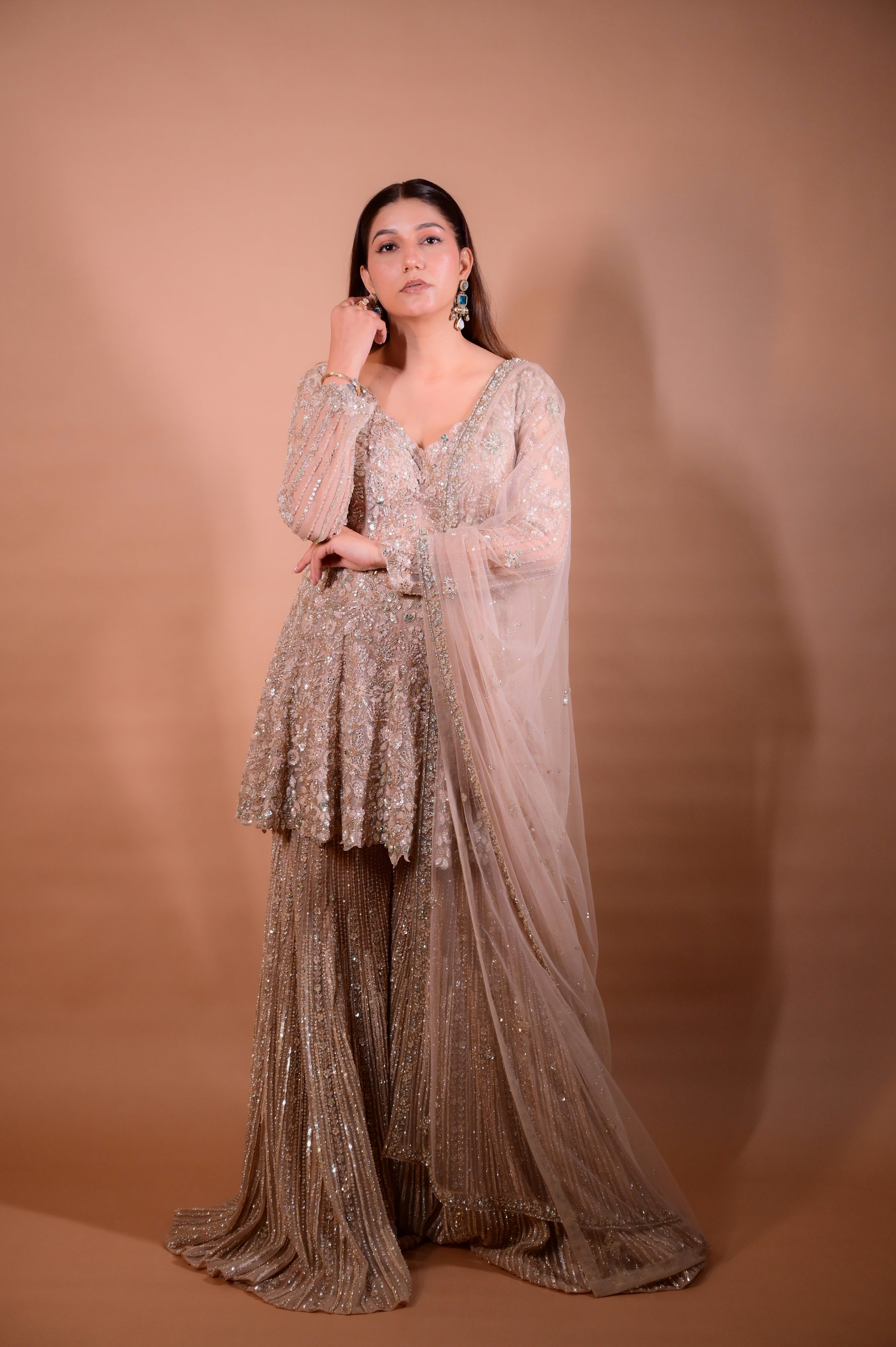 The Luxury Shimmering Peplum Sharara Wore by "Sapna Choudhary"