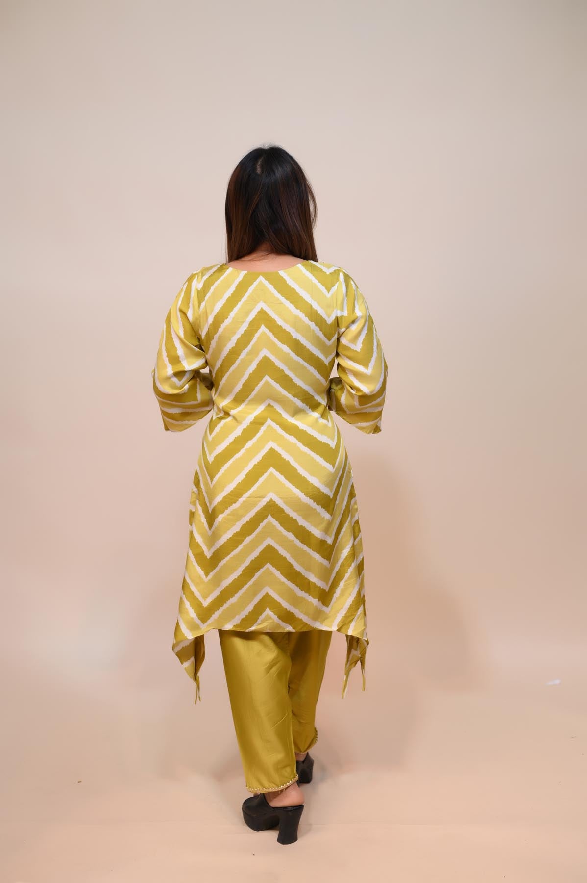 full back look of yellow muslin suit