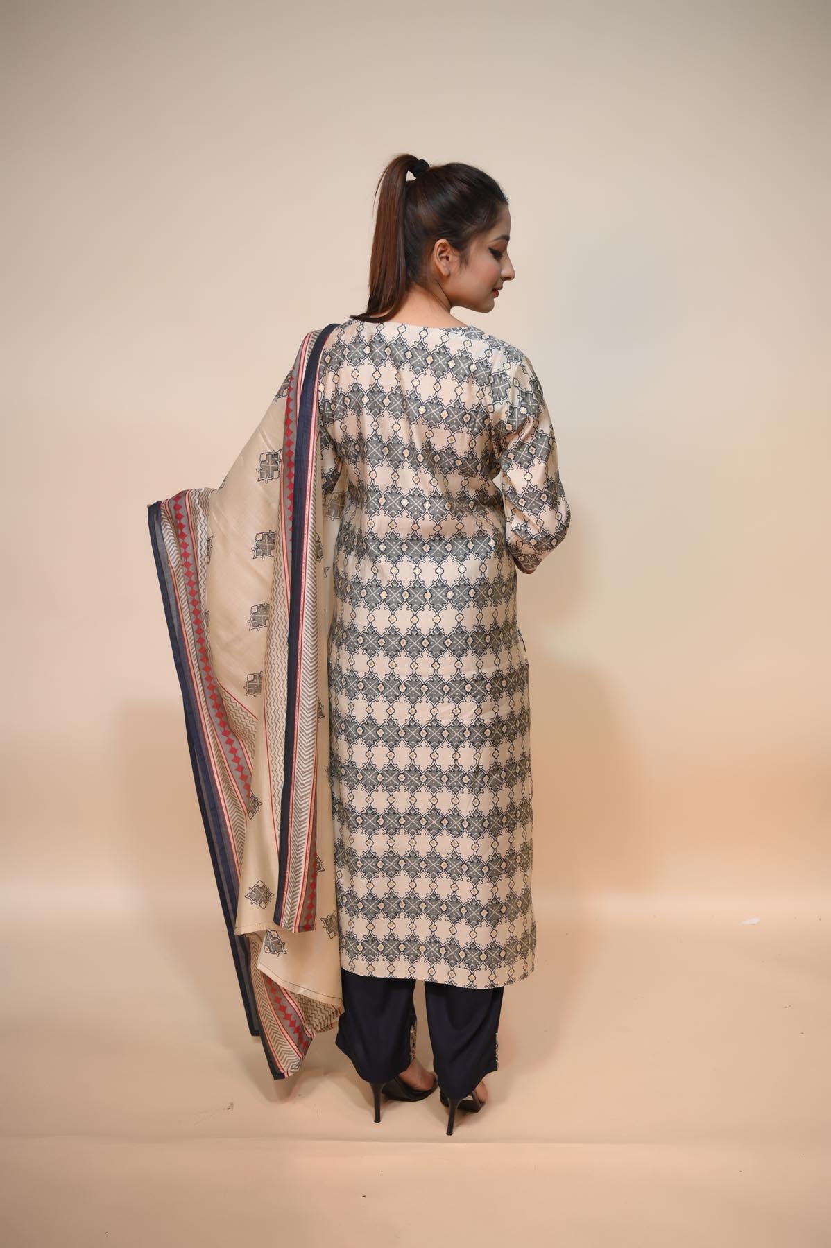 full back look of white and blue silk blend suit