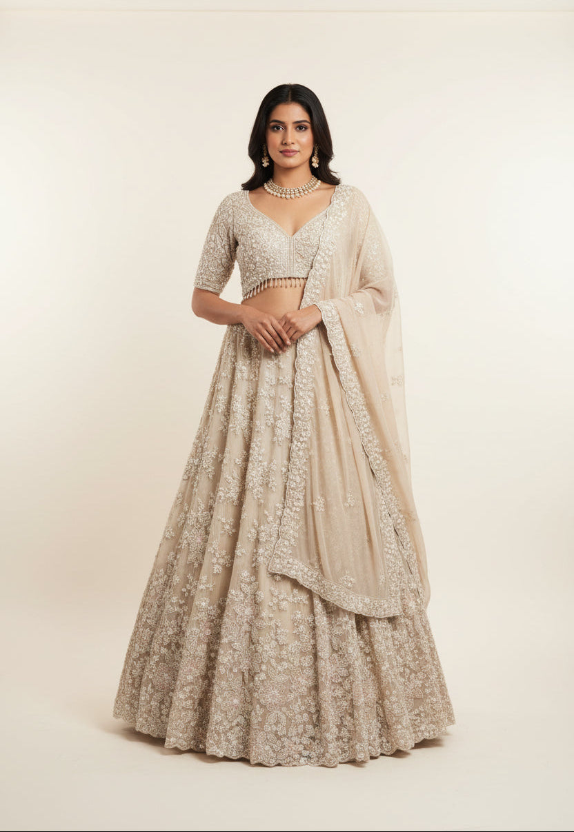 Ivory Radiance: Heavily Embellished Net Lehenga Set Main image