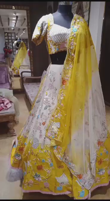 Elegant Yellow and White Silk Blend Lehenga with Half Sleeves and Intricate Embroidered Details
