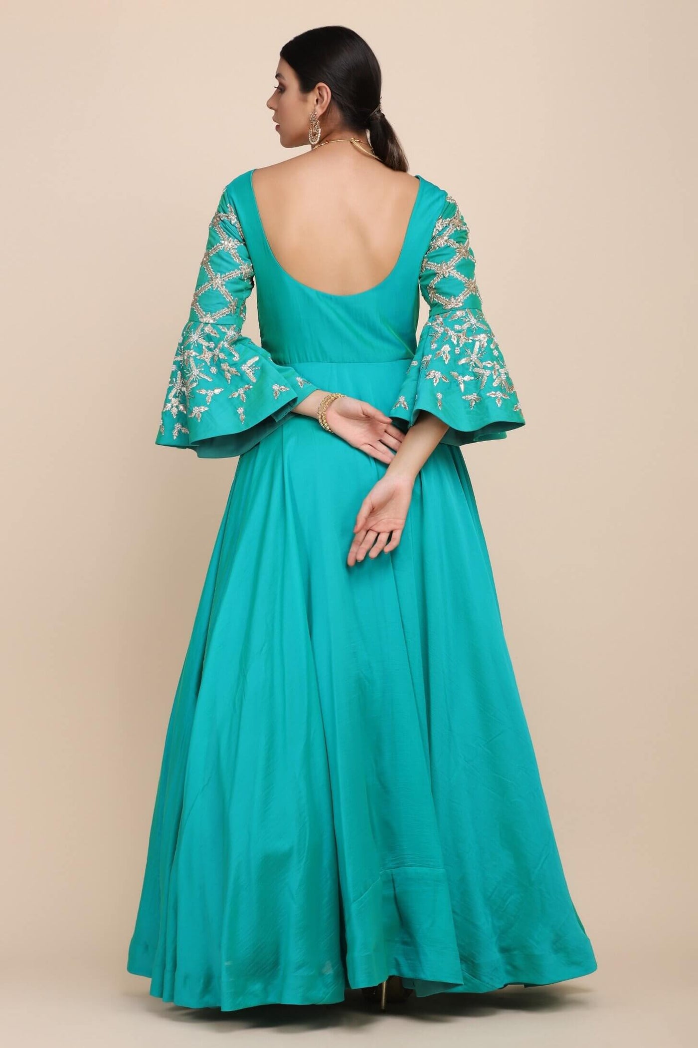 full back look of turquoise dress