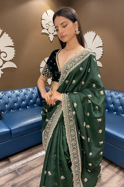 Classic green color floral motif embroidered saree with broad border and buttis with matching blouse