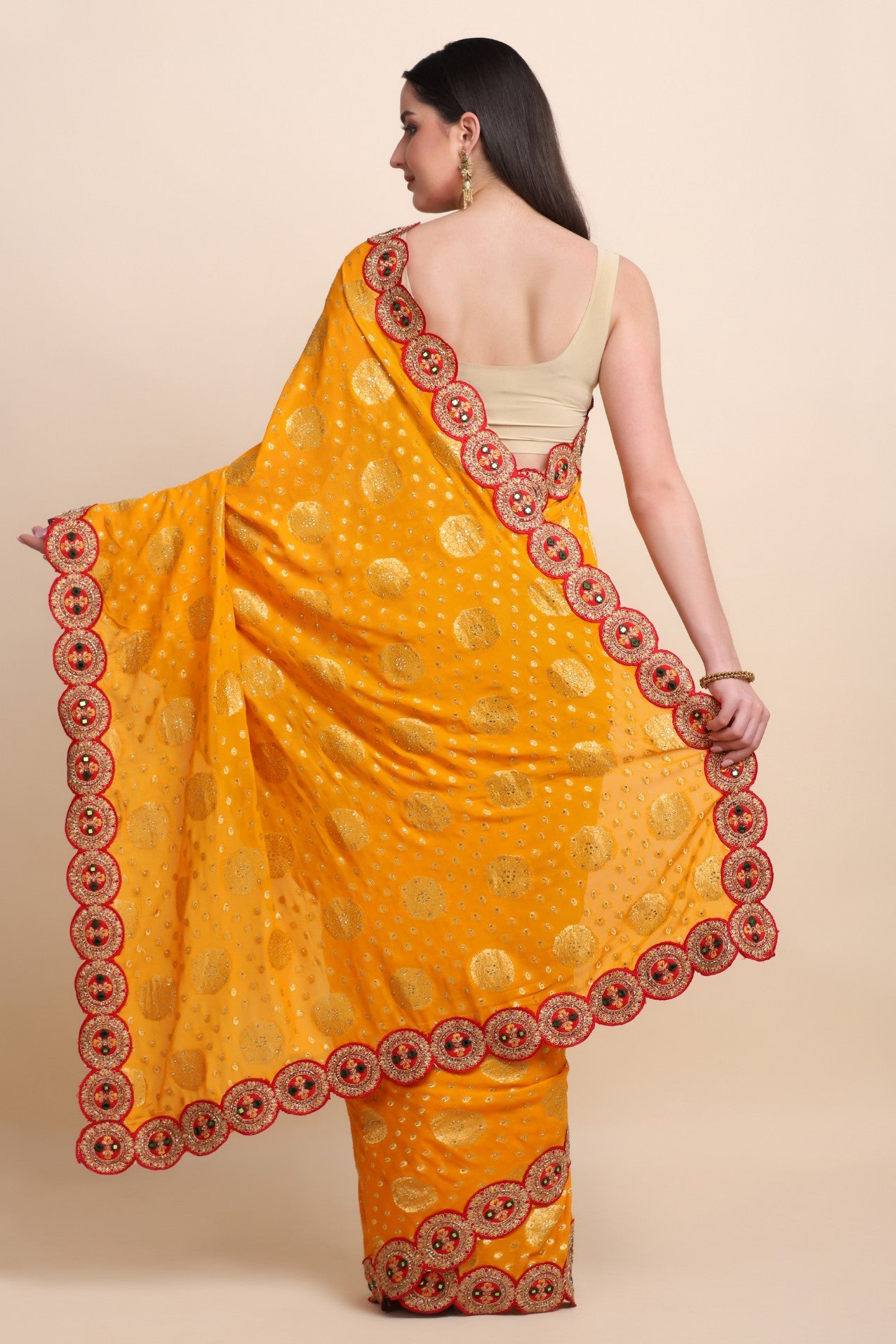 Classic yellow woven highlighted saree with embroidered red scalloped border and matching blouse