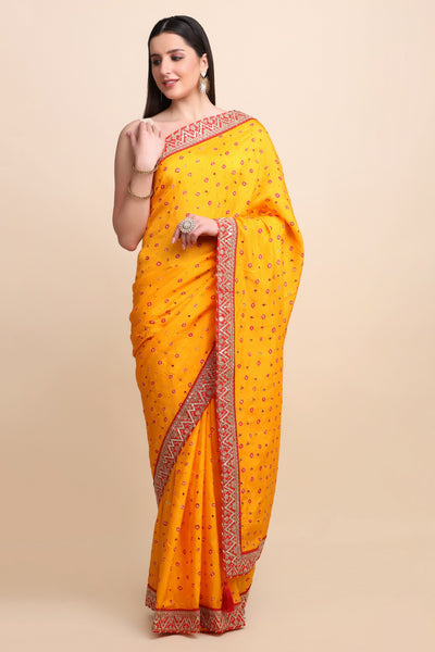 Beautiful yellow color tie & dye bandhini effect saree paired with matching blouse