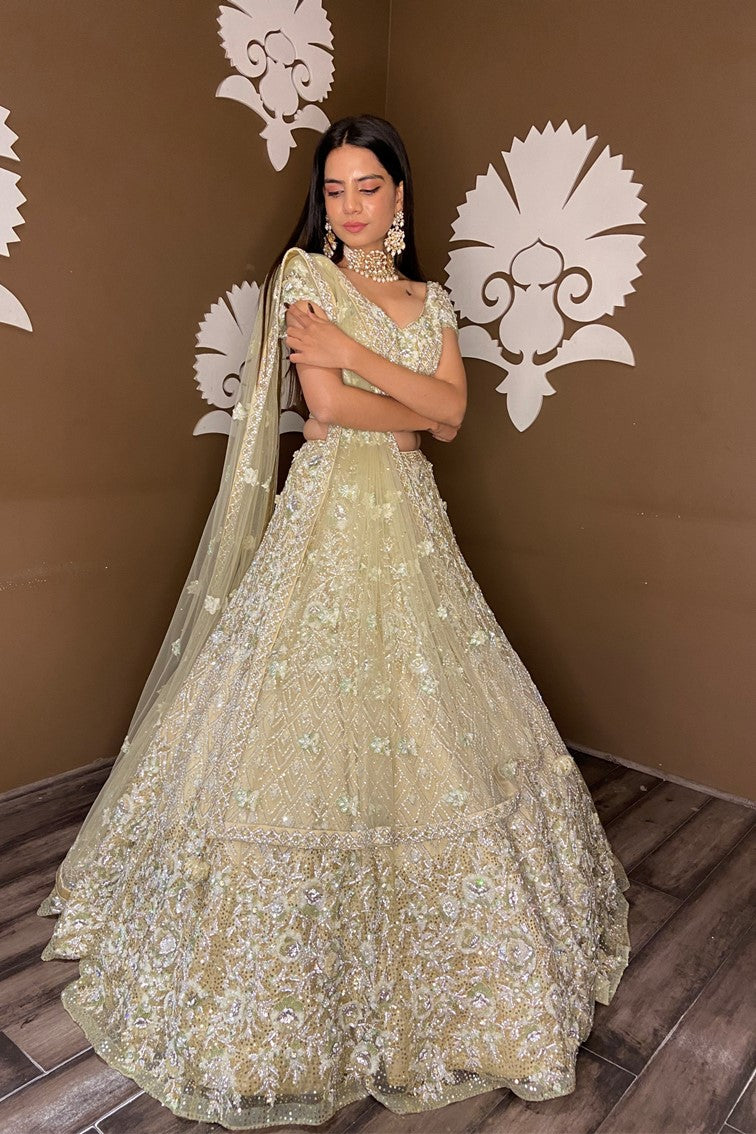 Beautiful light yellow color floral and textured pattern hand embroidered bridal lehanga