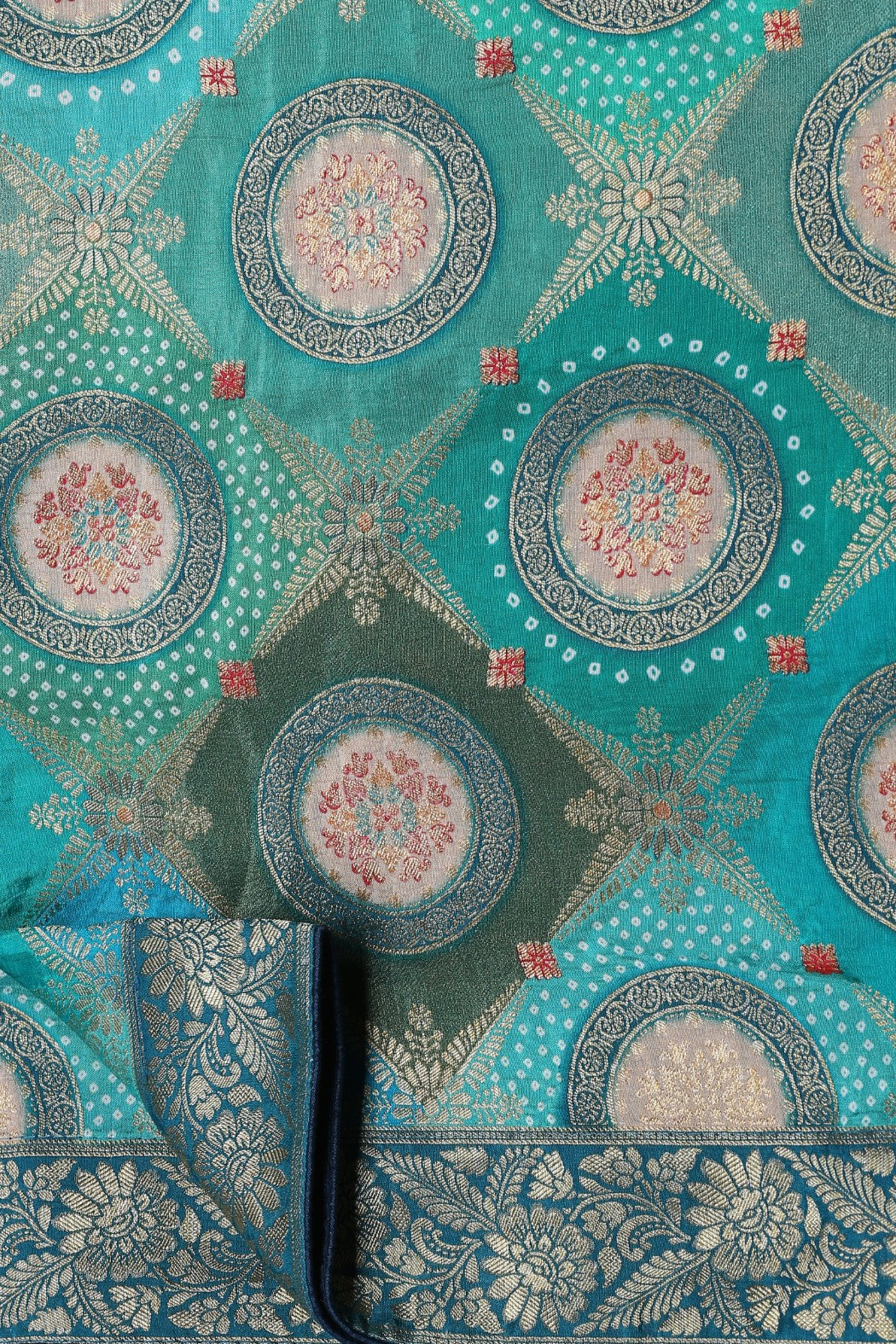 Beautiful two tone blue color floral motif bandhej & woven saree