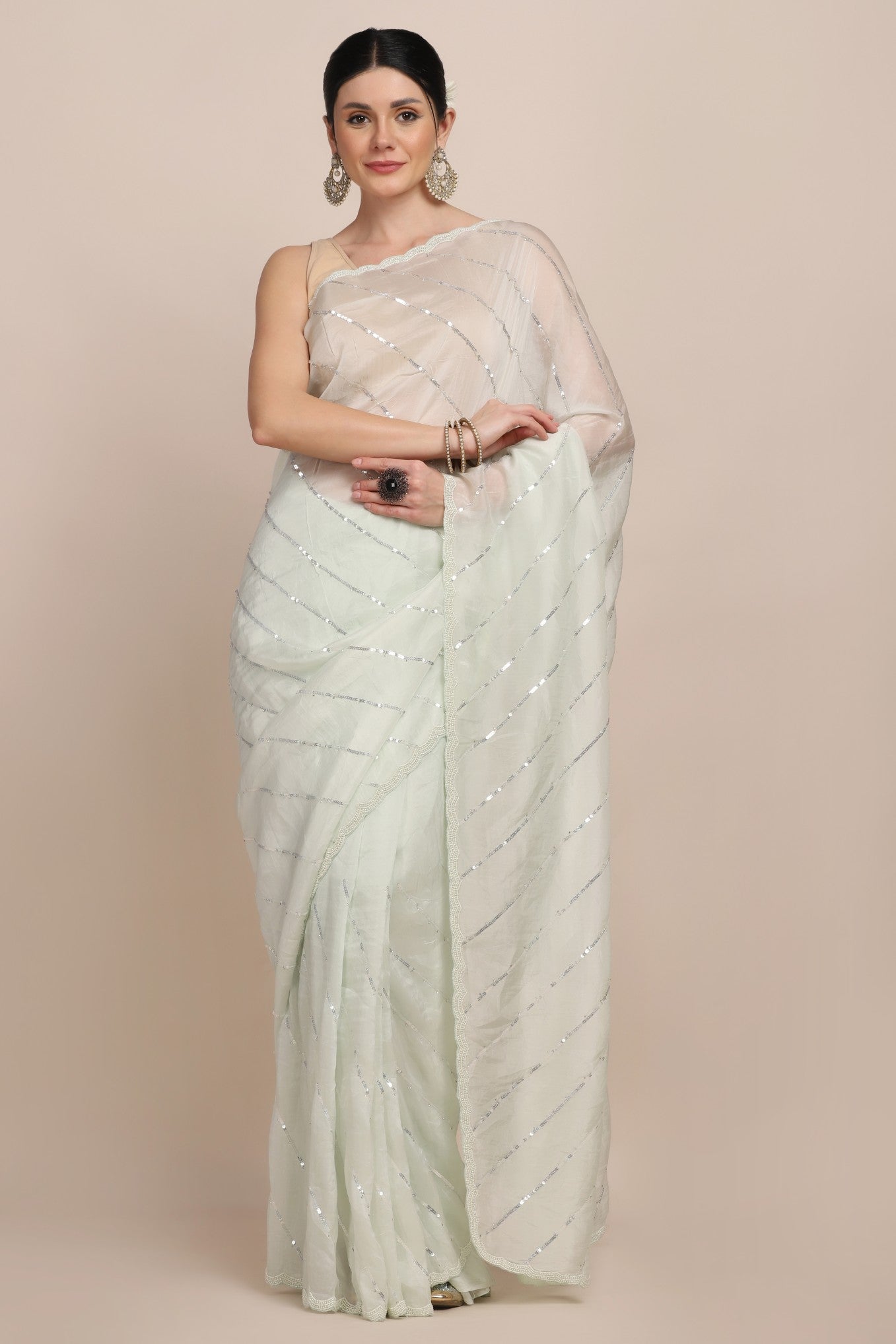Stylish mint green color sequin striped saree