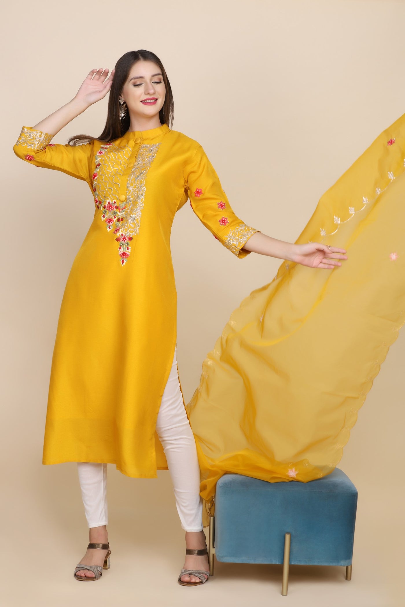 model posing in yellow embroidered kurti