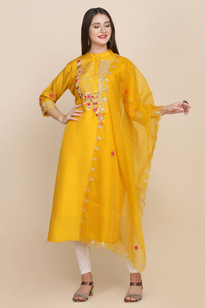 woman standing wearing yellow embroidered kurti