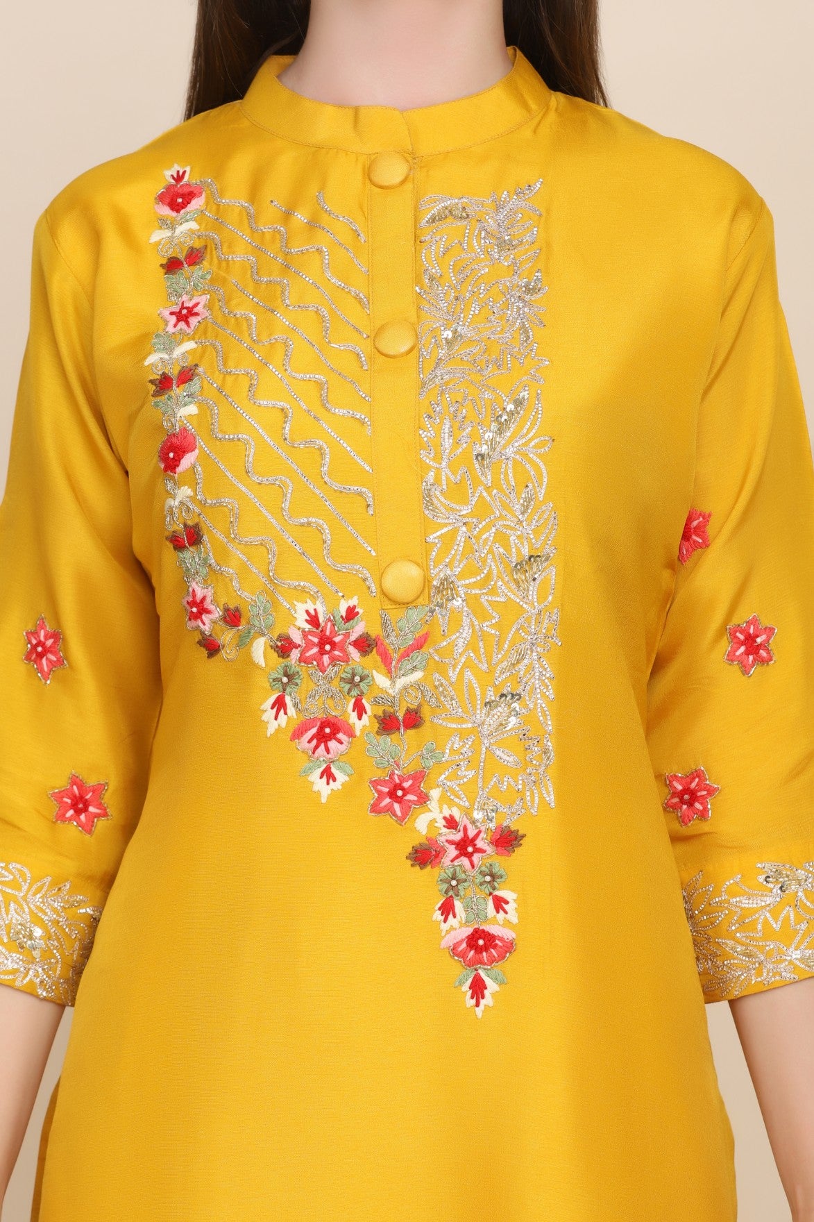 closer look of details of yellow embroidered kurti