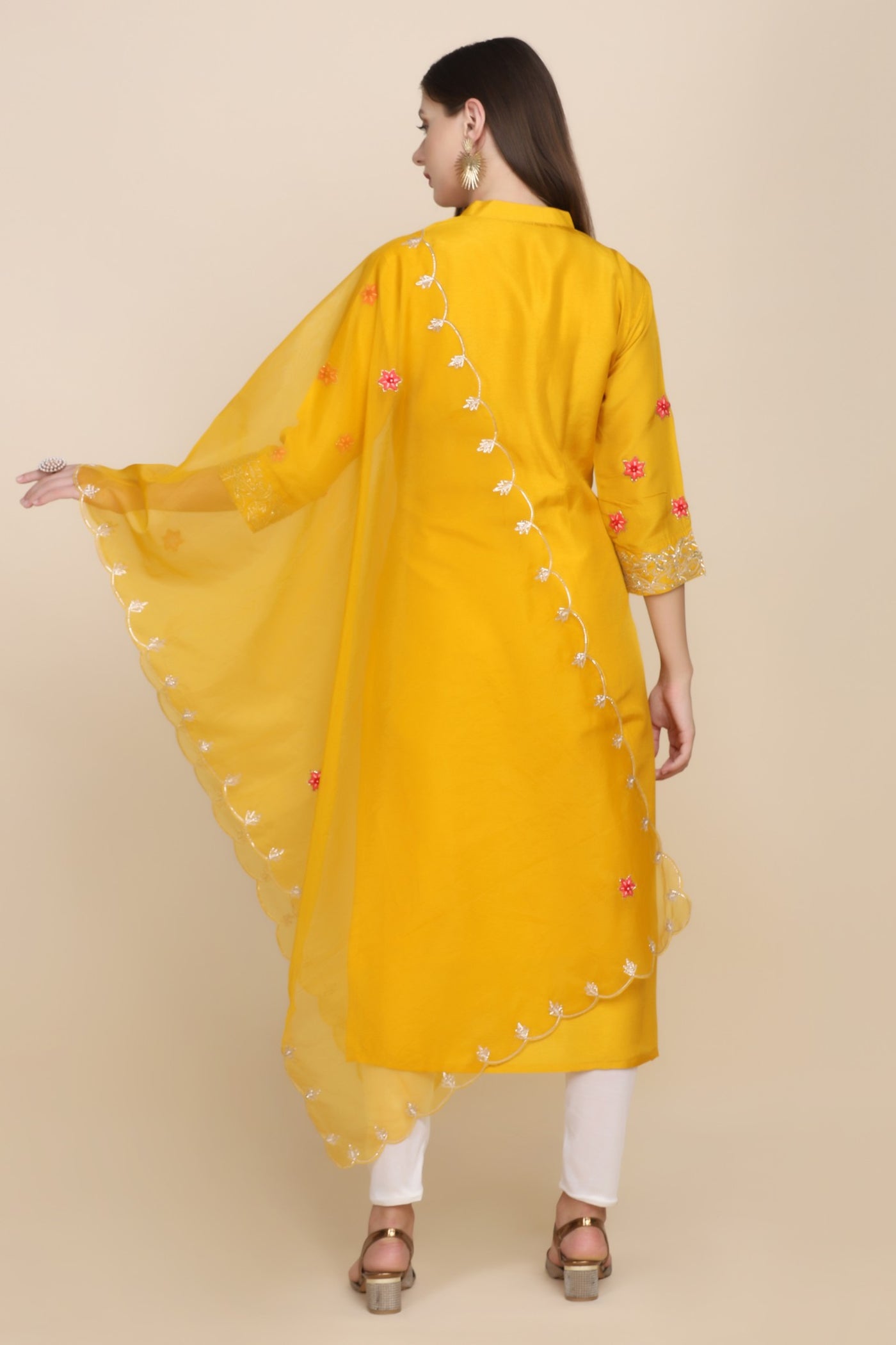 full back look of yellow embroidered kurti