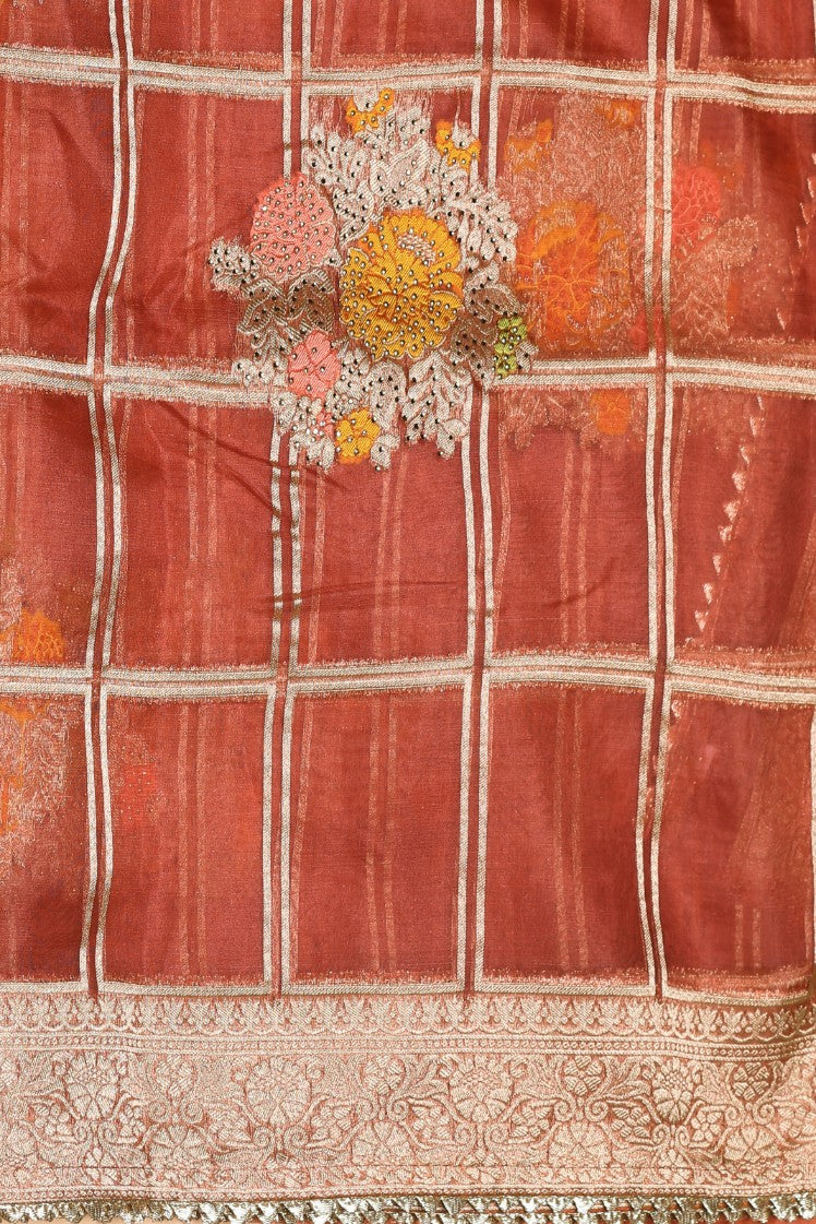 Beautiful rust orange color floral motif highlighted saree