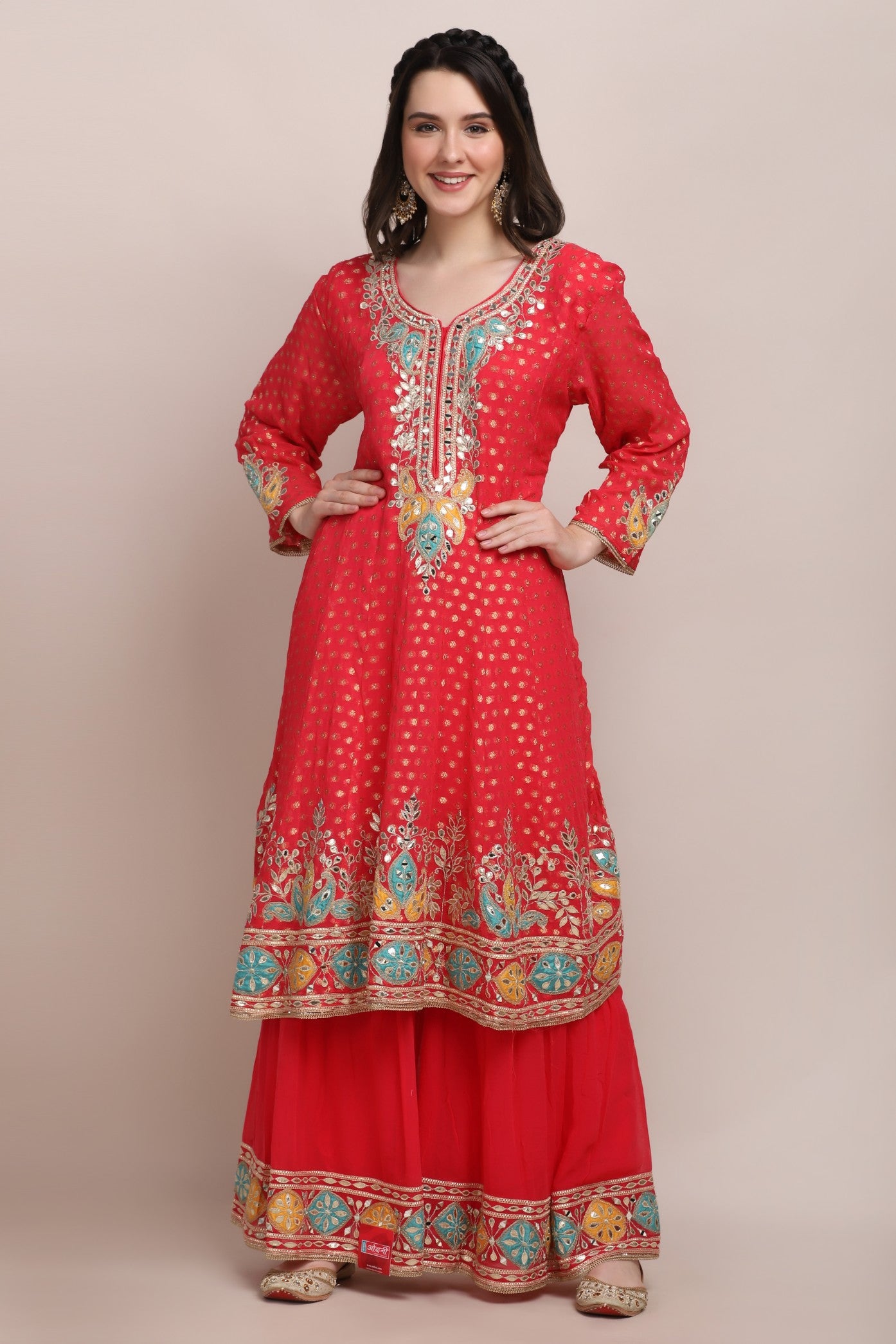 woman standing wearing trendy embroidered kurti set