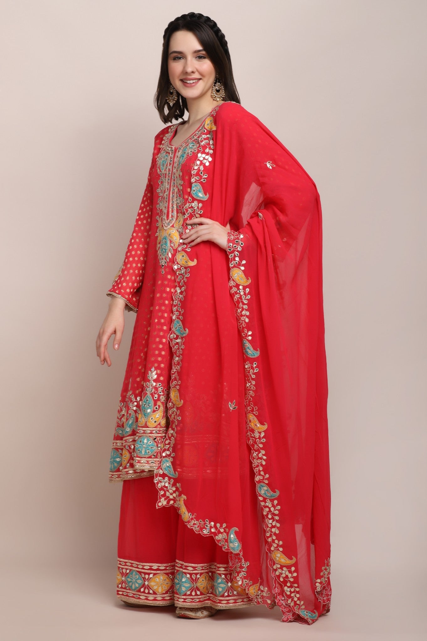 model side posing wearing trendy embroidered kurti set