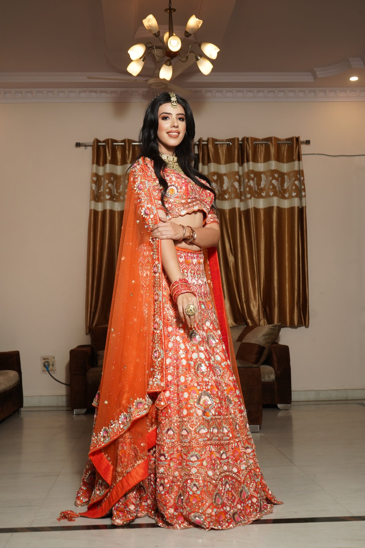Classy orange color floral motif hand embroidered lehanga