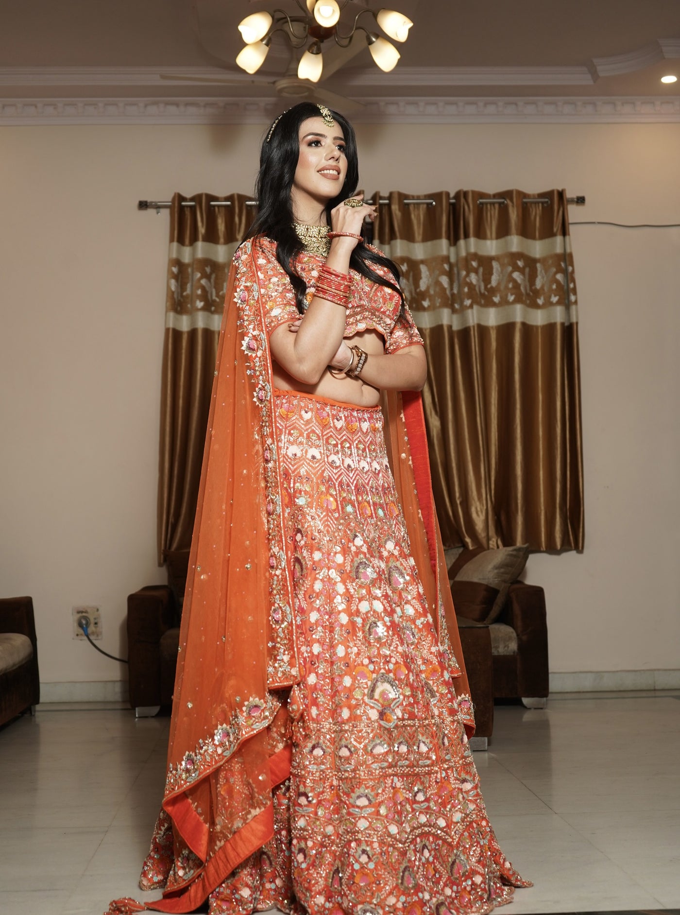Classy orange color floral motif hand embroidered lehanga