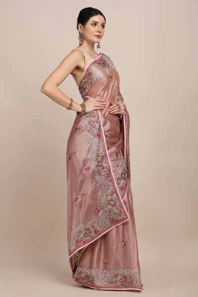 side profile of woman in Onion pink floral embroidered saree