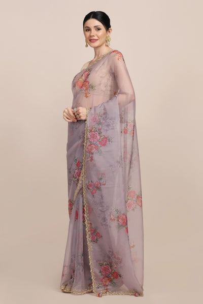 woman posing in floral printed saree