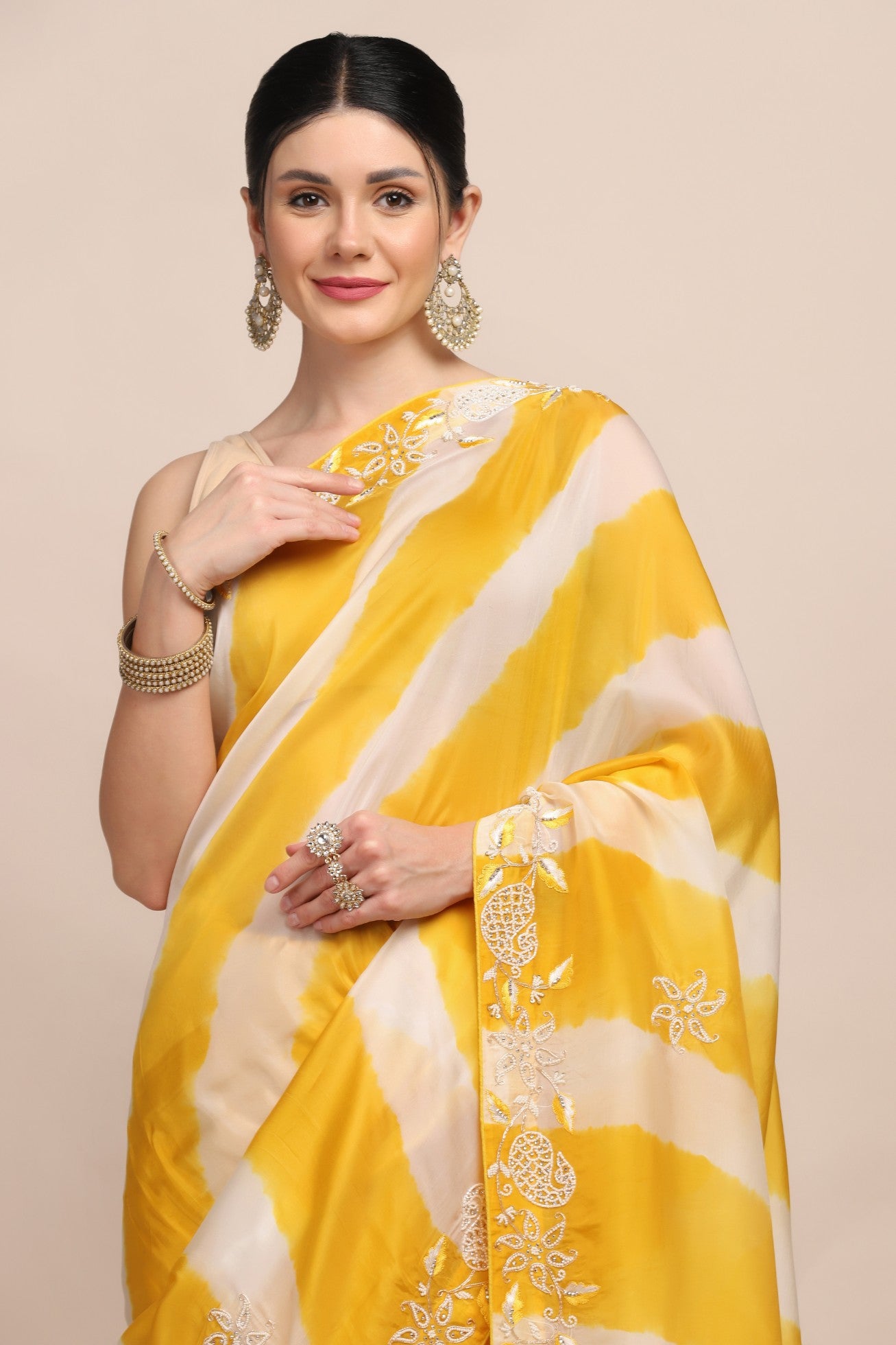 Elegant yellow color tie and dye embroidered saree