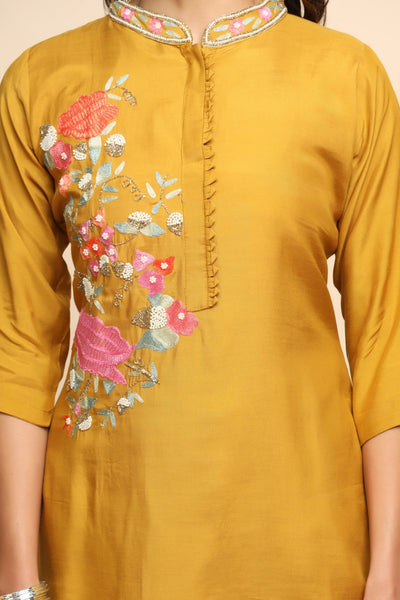 Beautiful mustard color floral motif embroidered suit